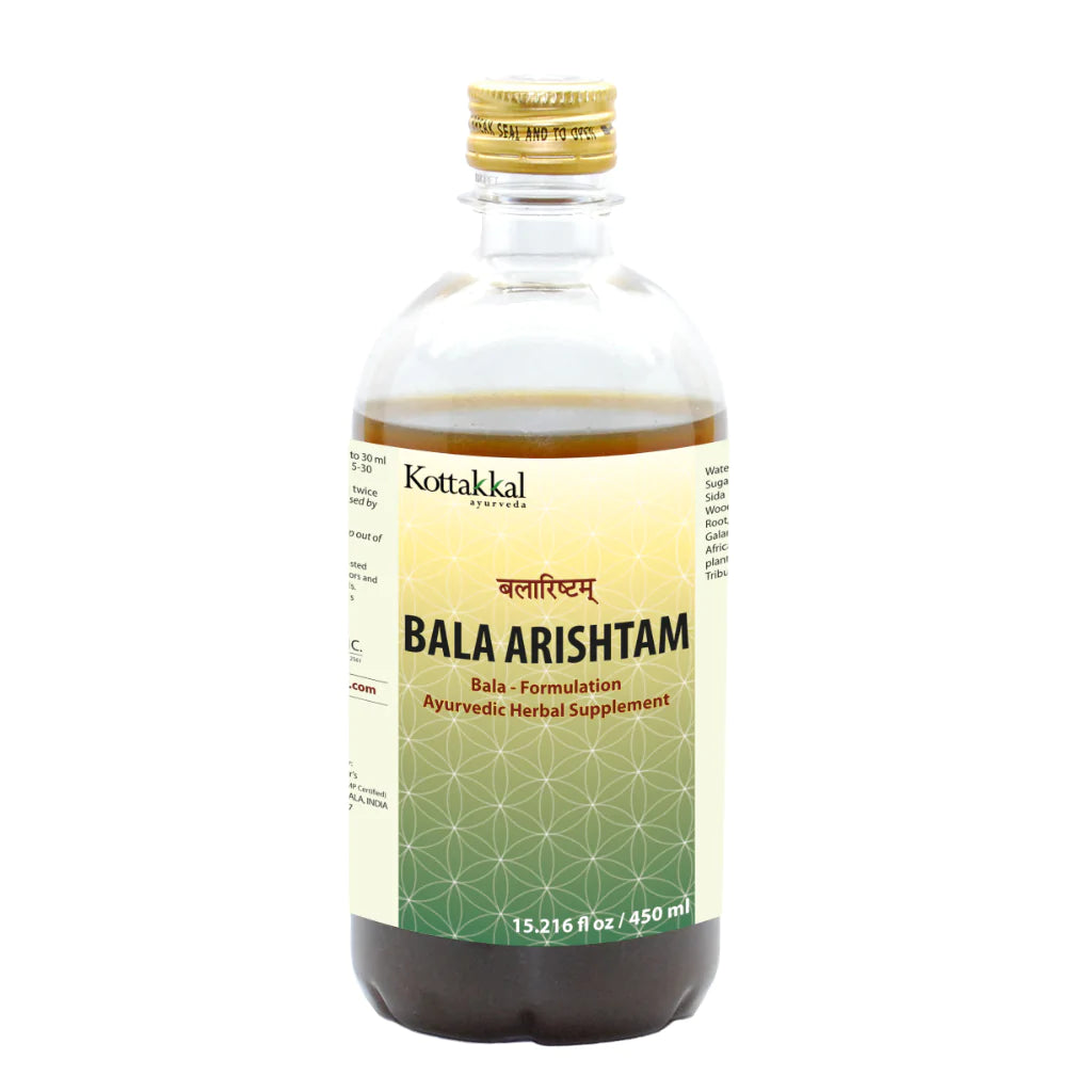 A bottle of KT Bala Arishtam, a liquid Ayurvedic herbal supplement.