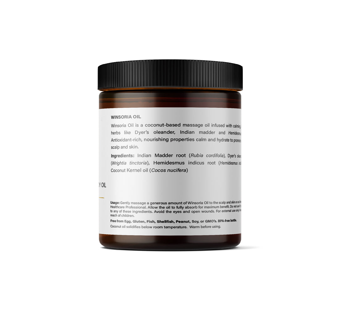 Back view of A jar of Kerala Ayurveda Calming Scalp and Body Oil with a label that includes the product ingreadients.