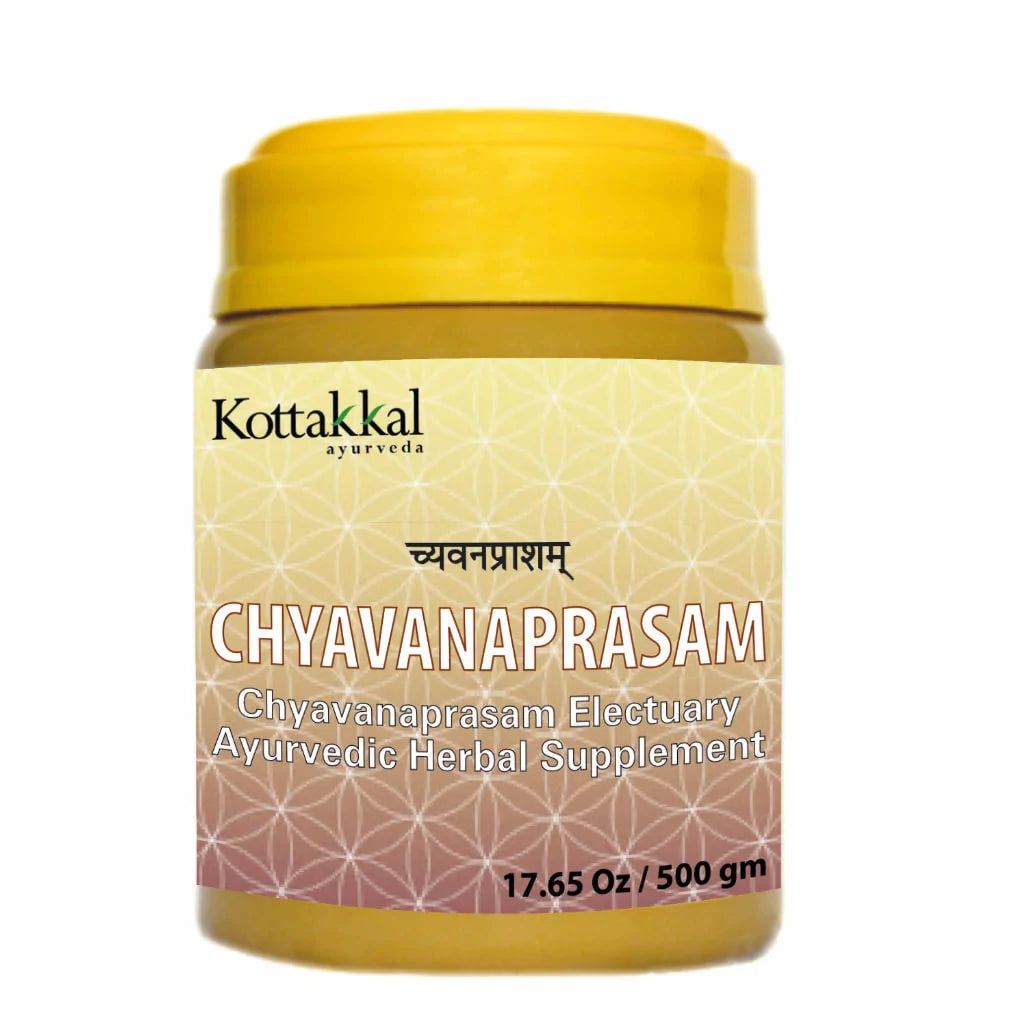 A yellow jar of Kottakkal Chyavanaprasam Ayurvedic Herbal Supplement, 500g size.