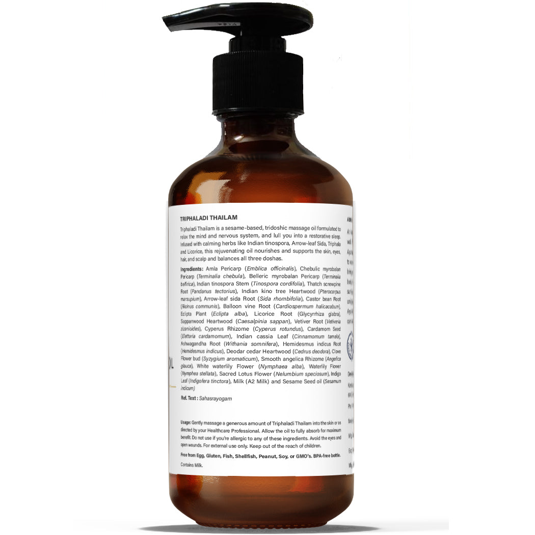 A back view bottle of Tridoshic Massage Oil (Thriphaladi Thailam) with a pump dispenser, labeled with the product details and ingredients
