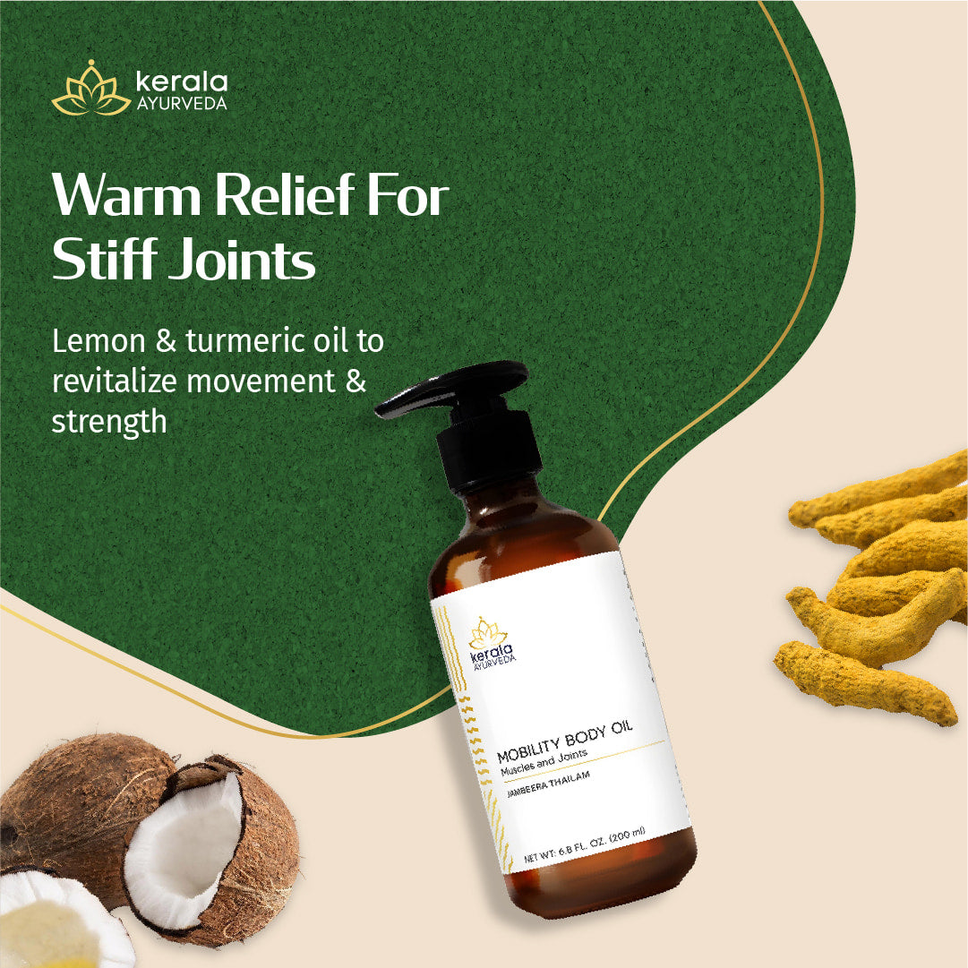 Kerala Ayurveda mobility body oil bottle with lemon and turmeric on a beige background