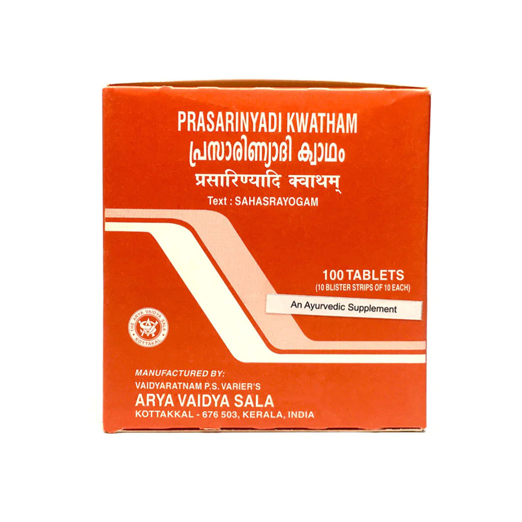 A box of KT Prasarinyadi Kwatham, an ayurvedic Supplement tablets with 100 tablets inside. The packaging is primarily red and orange with white text and branding related to the product and the manufacturer, Arya Vaidya Sala.