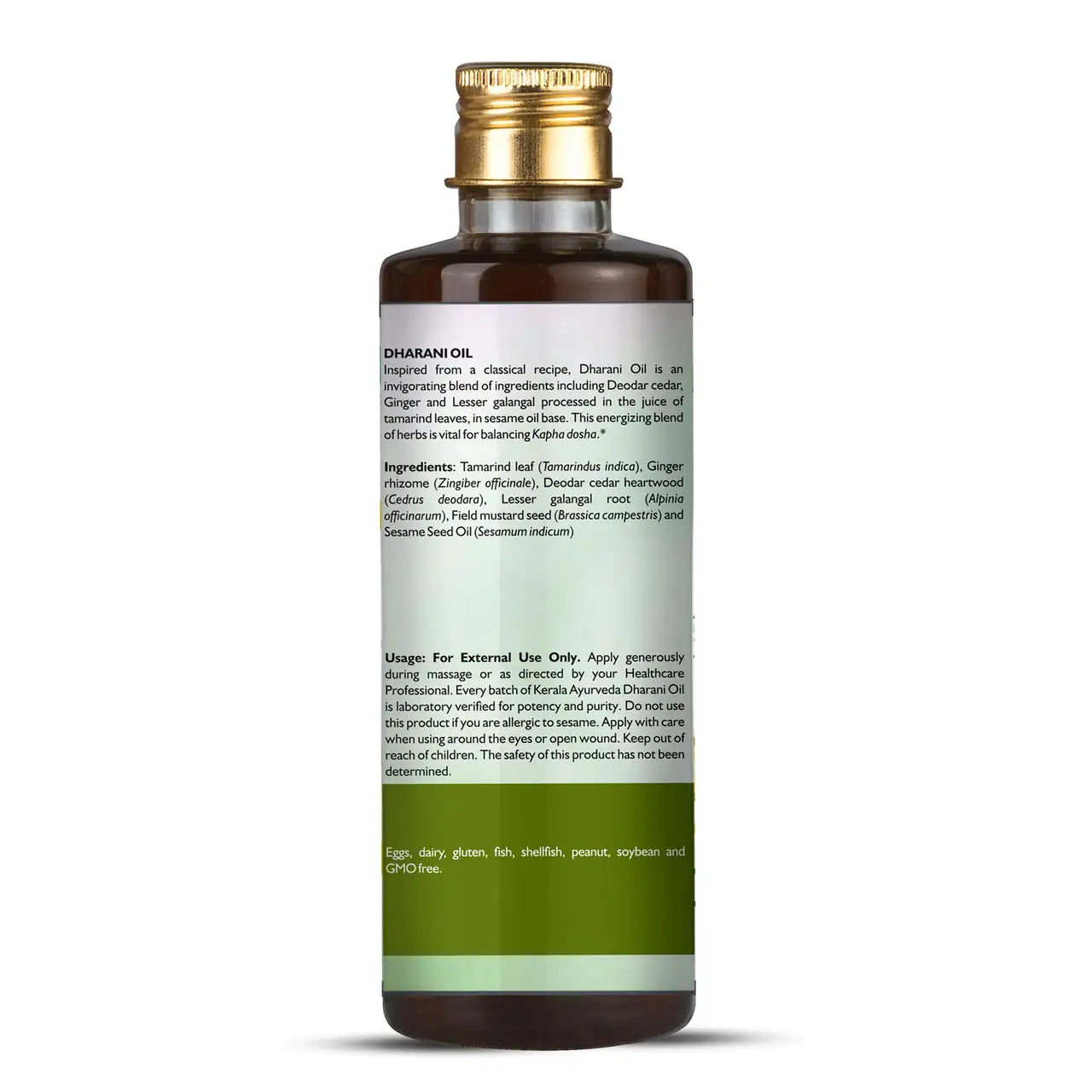 A bottle of Dharani Oil by Kerala Ayurveda for Kapha management with a label showing the product ingredients