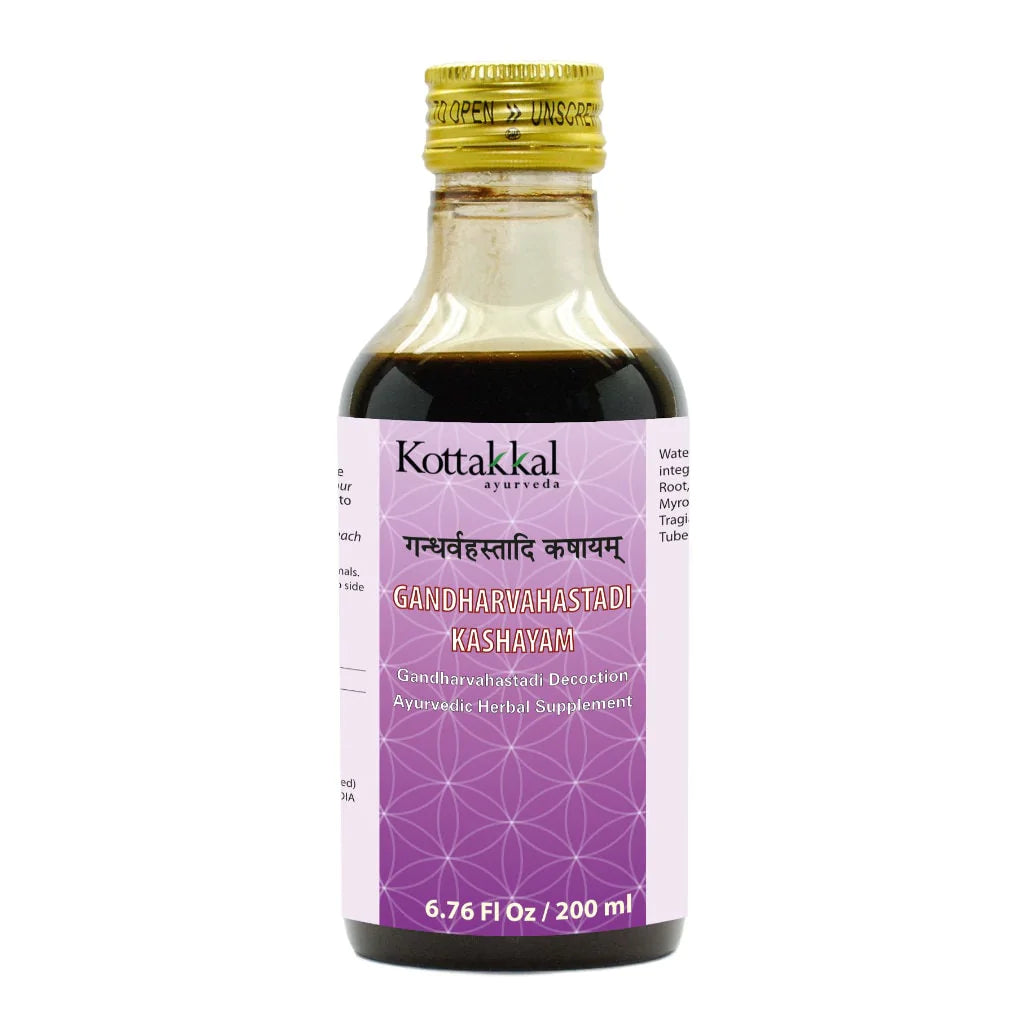 A bottle of KT Gandharvahastadi Kashayam herbal supplements by Kottakkal with a purple label, text in Devanagari script, and a capacity indicator of 6.76 Fl Oz / 200 ml.