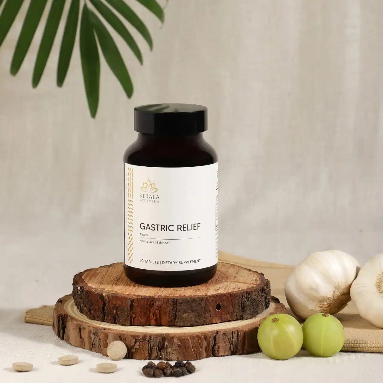A bottle of Kerala Ayurveda Gastric Relief, containing 90 tablets for dietary supplement in a beige background