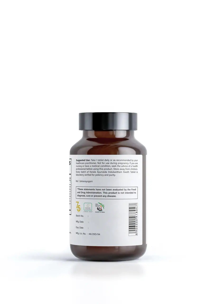 A Back label view of a bottle of Indukantham Kwath, 90 tablets, dietary immune support supplement with a white and brown label, Kerala Ayurveda brand. Label Indicates ingredients of the product. 