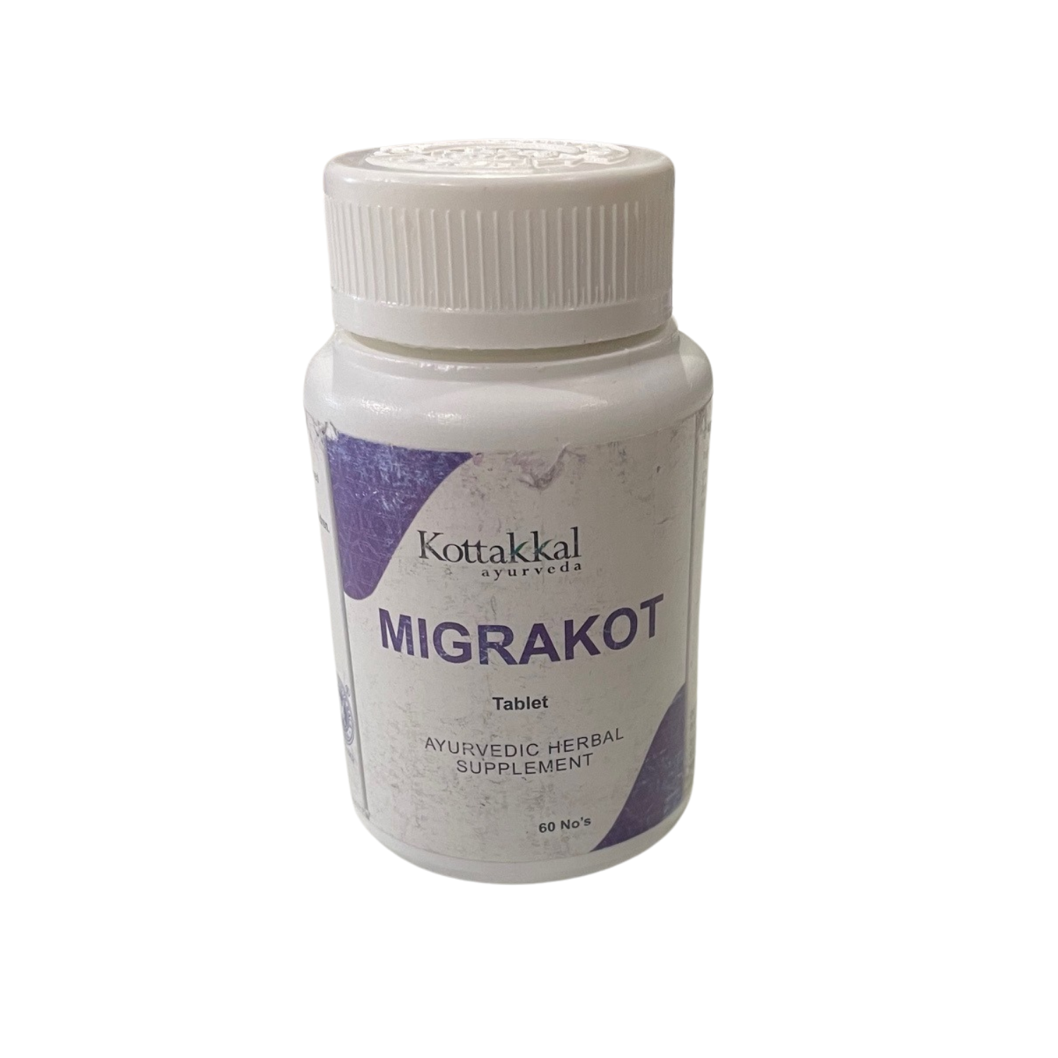 A bottle of KT Migrakot 60 Tablets by Kottakkal, a Ayurvedic herbal supplement.