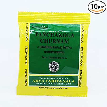 A yellow packet of KT Panchakola Churnam 10 g, with green and black text, branding, and a logo.