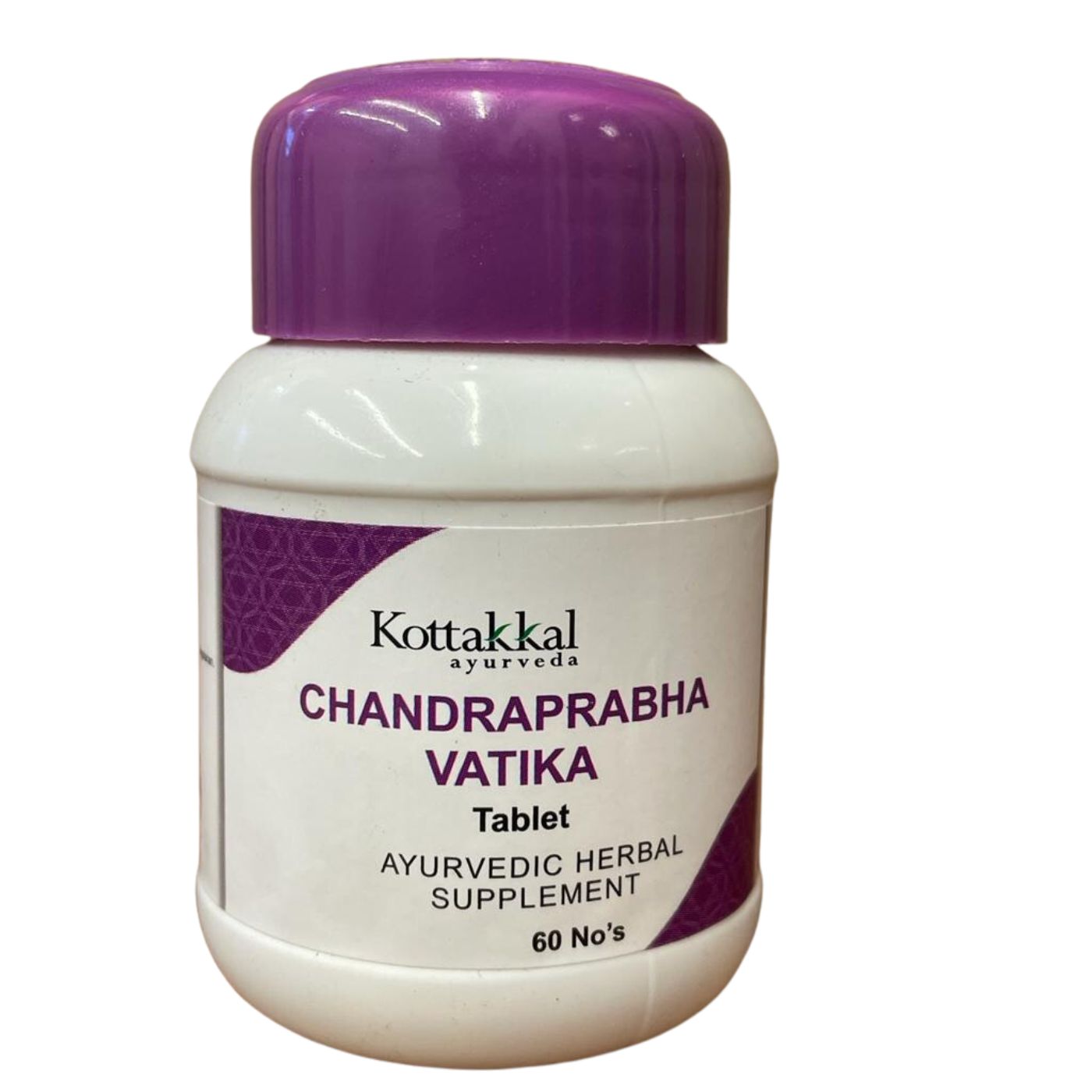 A bottle of Kottakkal Chandraprabha Vatika tablets with 60 tablets inside. The bottle is white with a purple cap and a label that indicates it is an Ayurvedic herbal supplement.