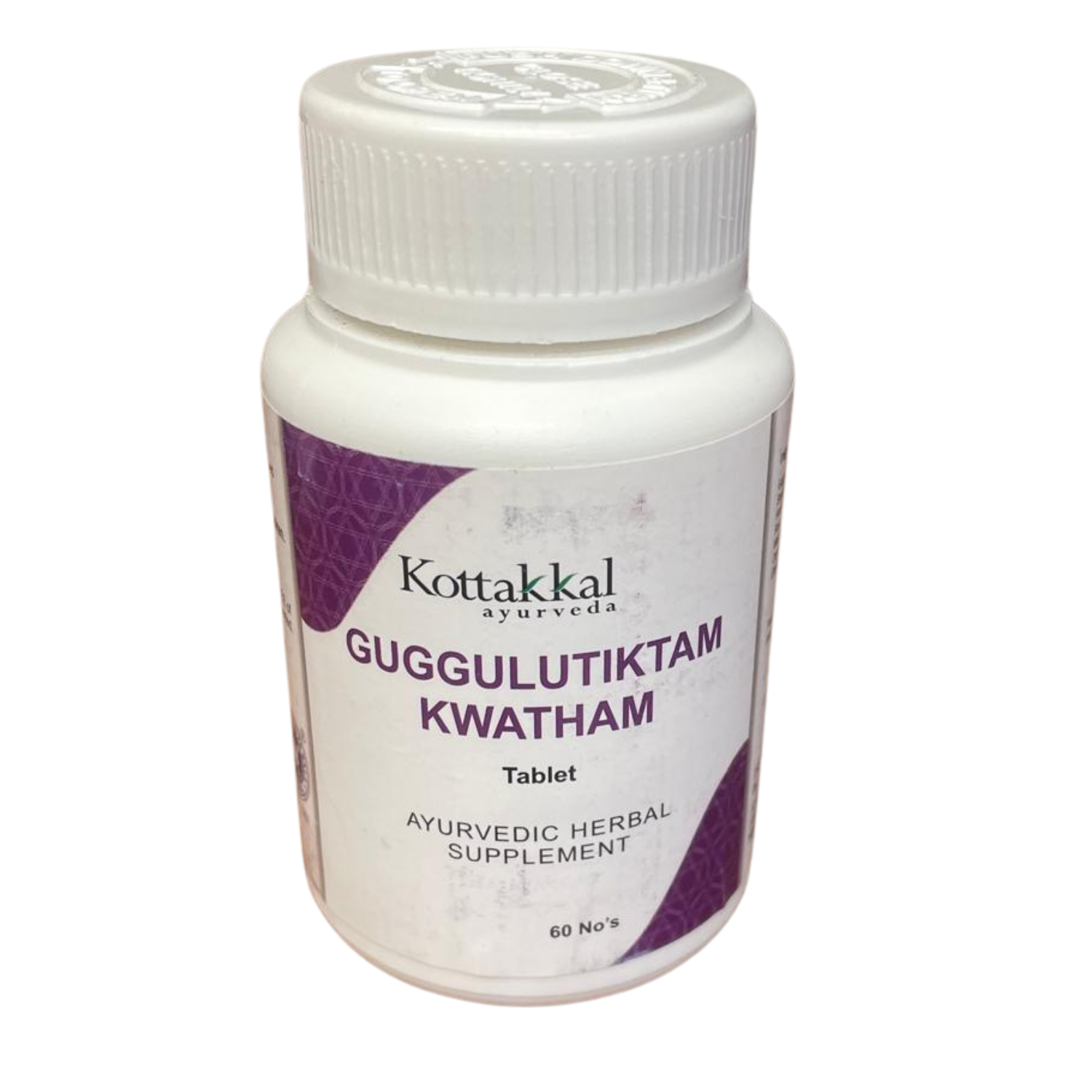 A bottle of Kottakkal Guggulutiktam Kwatham herbal supplement 60 Tablets, with a white label and purple text.