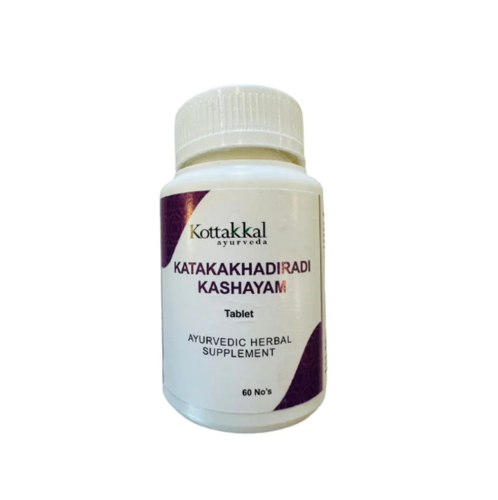 A bottle of KT Katakakhadiradi Kashayam, 60 herbal supplements Tablets, with a label that includes the product name and branding.