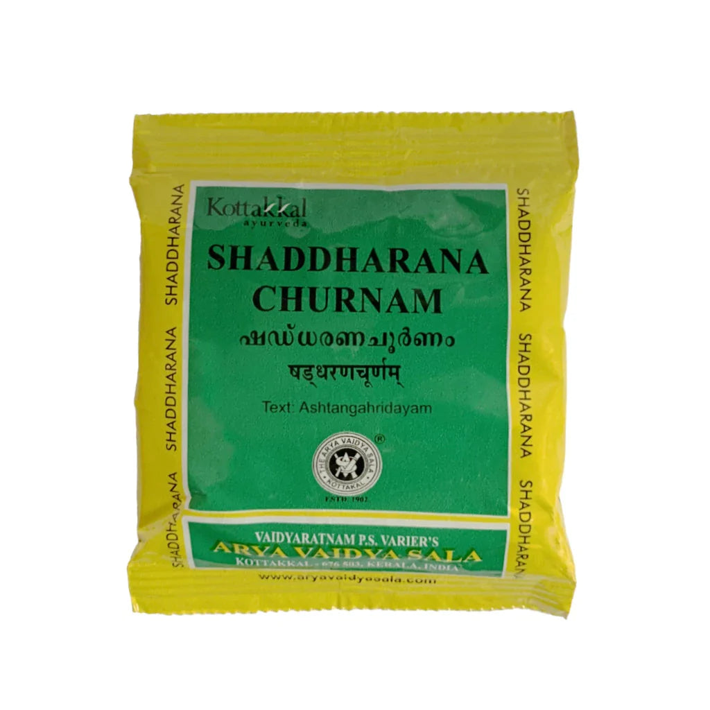 Packaging of KT Shaddharana Churnam, a digestive medicine in a yellow and green sachet with text and branding.